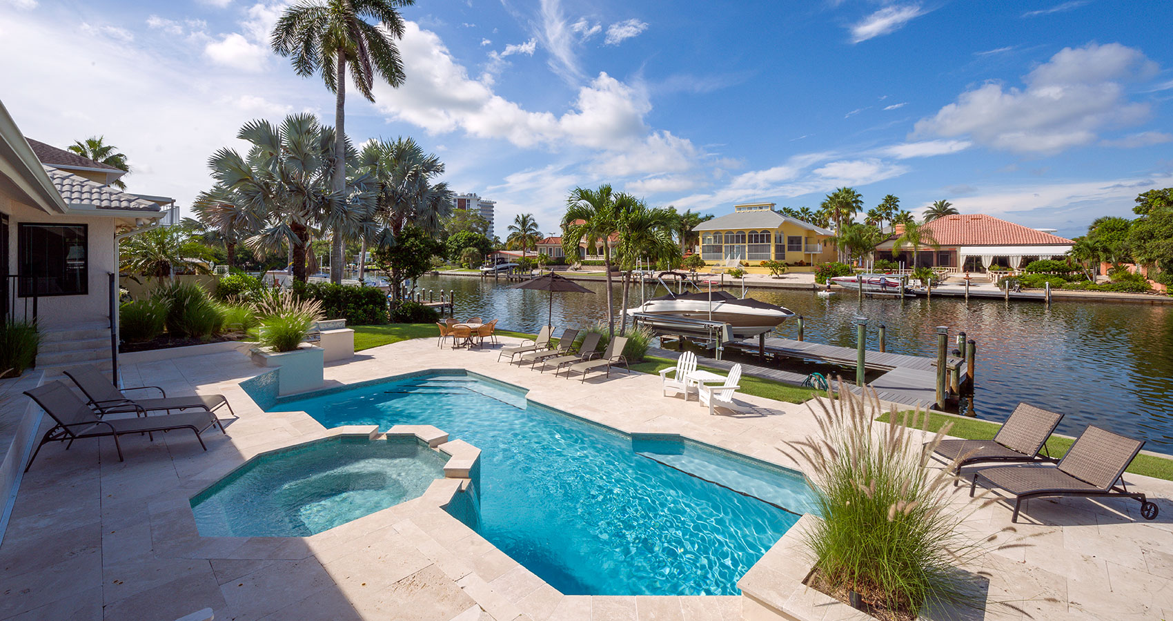 Boats and a private pool line one of Sarasota's many bay-access inlets