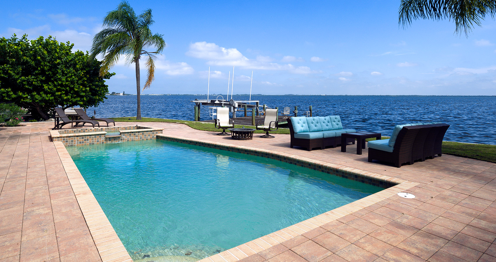 A stunning gulf-facing swimming pool with tiki motif