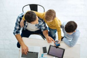 A family looking up the average weather in Sarasota.