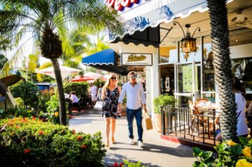 a couple walking around St. Armand's Circle