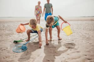A family looking for shells on the beach on a Florida spring break.